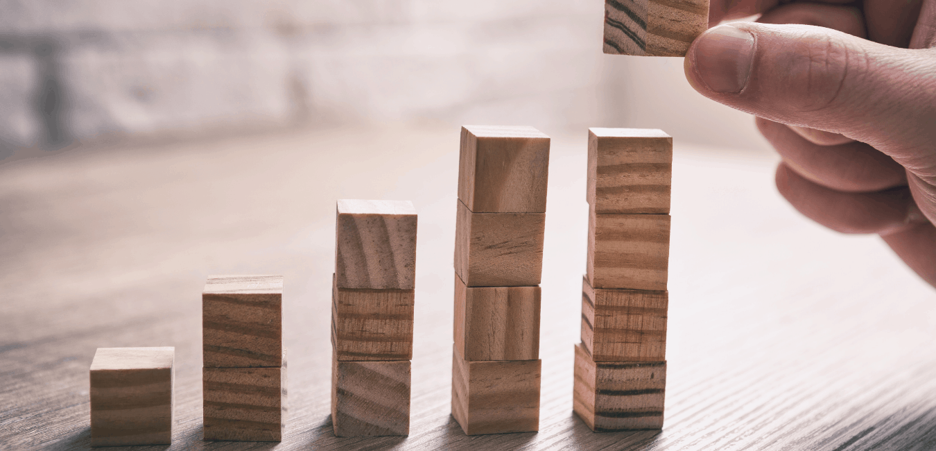 Hand stacking wooden cubes